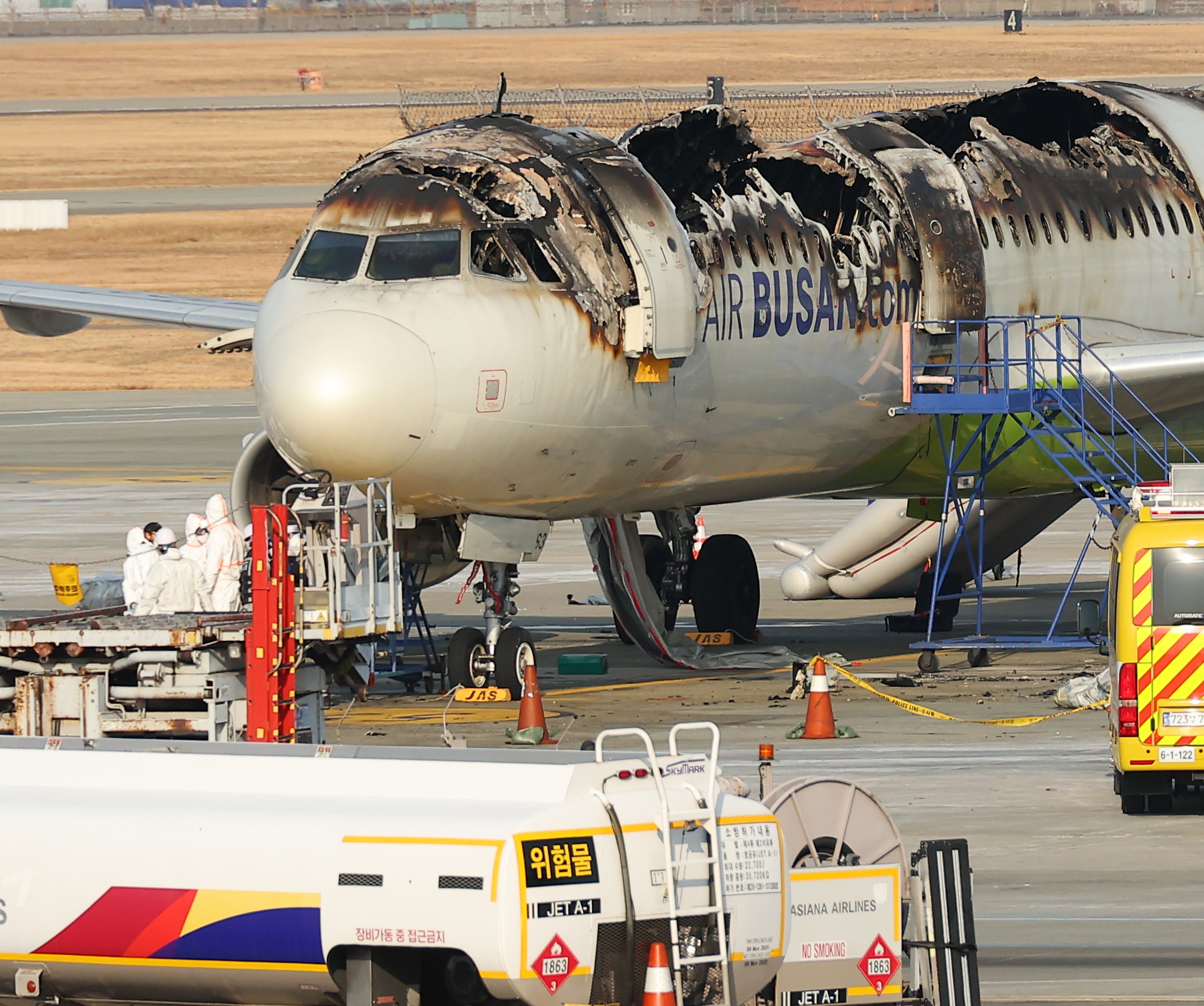 Stability inspection of a fire-damaged Air Busan passenger plane.