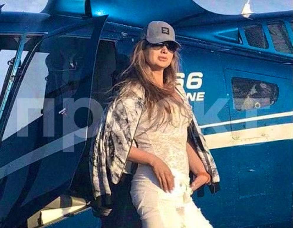 Svetlana Krivonogikh standing by a helicopter.