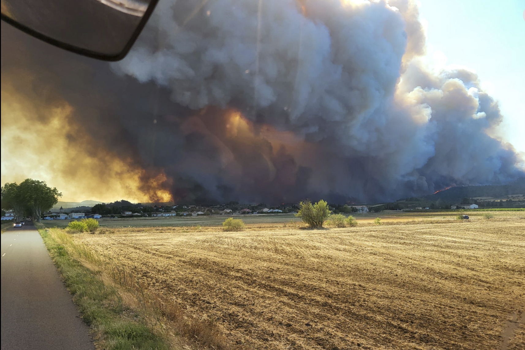 Wildfire smoke over a field in southern France.