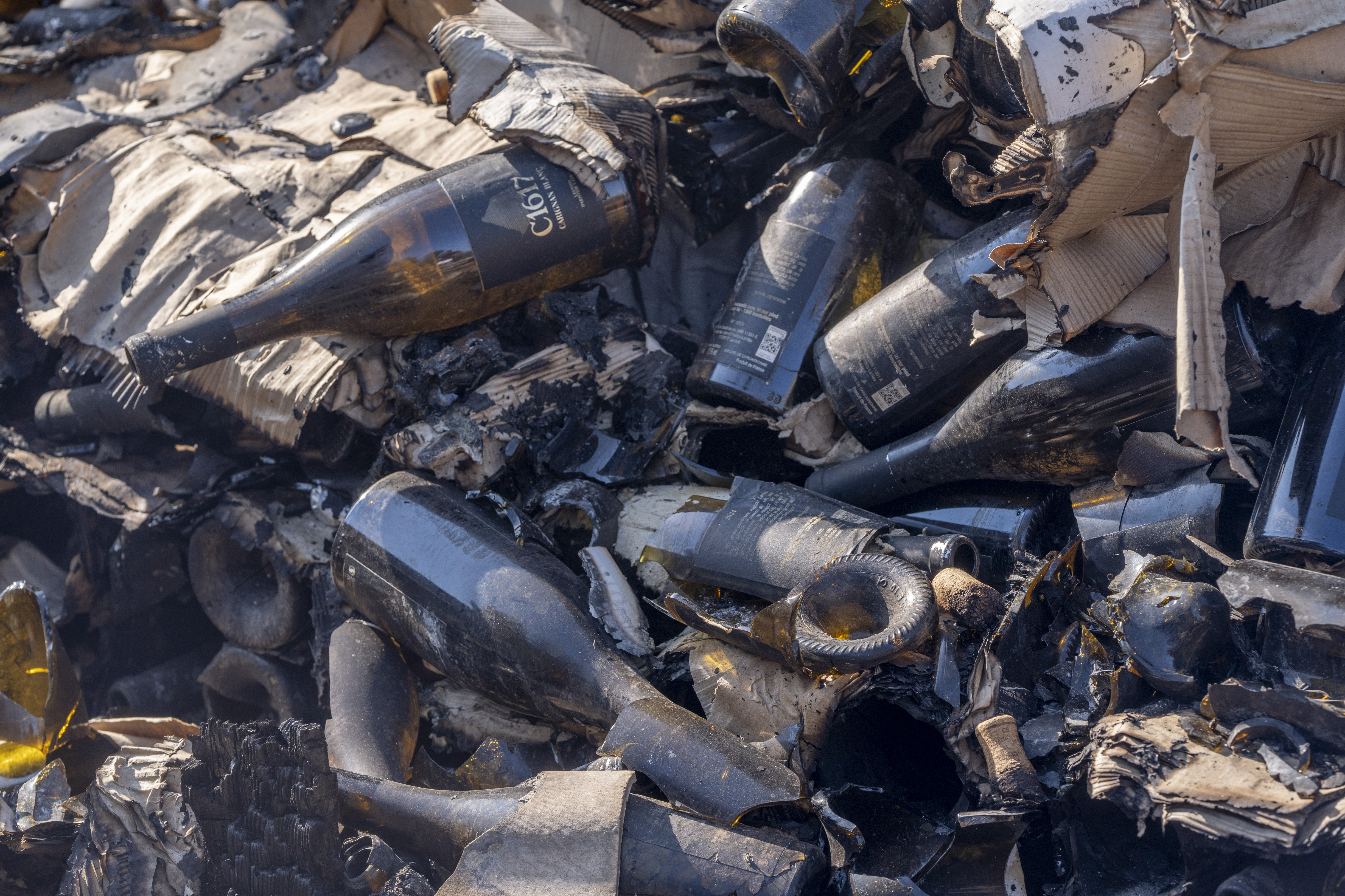 Burned wine bottles and packaging.
