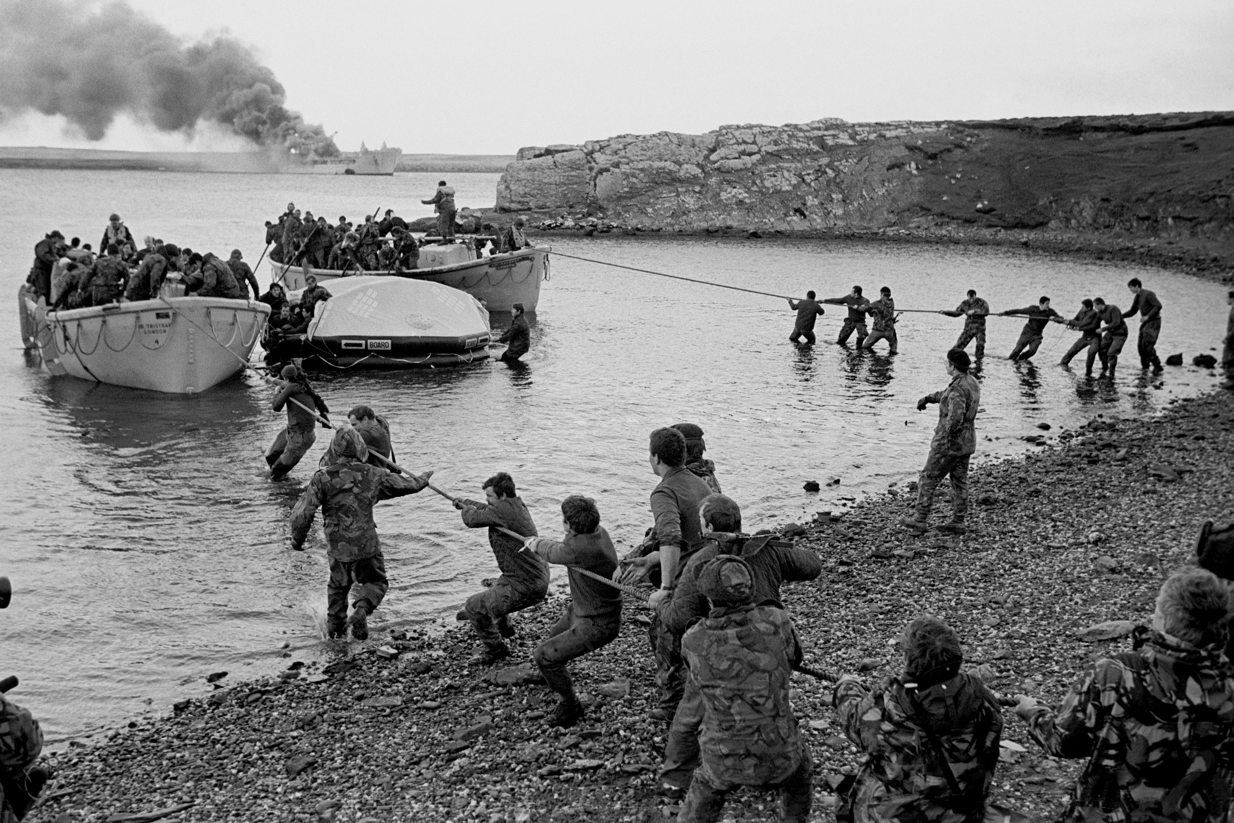 Falklands War: Survivors of the Argentinian air attack on the RAF Sir Galahad being hauled ashore at Bluff Cove.