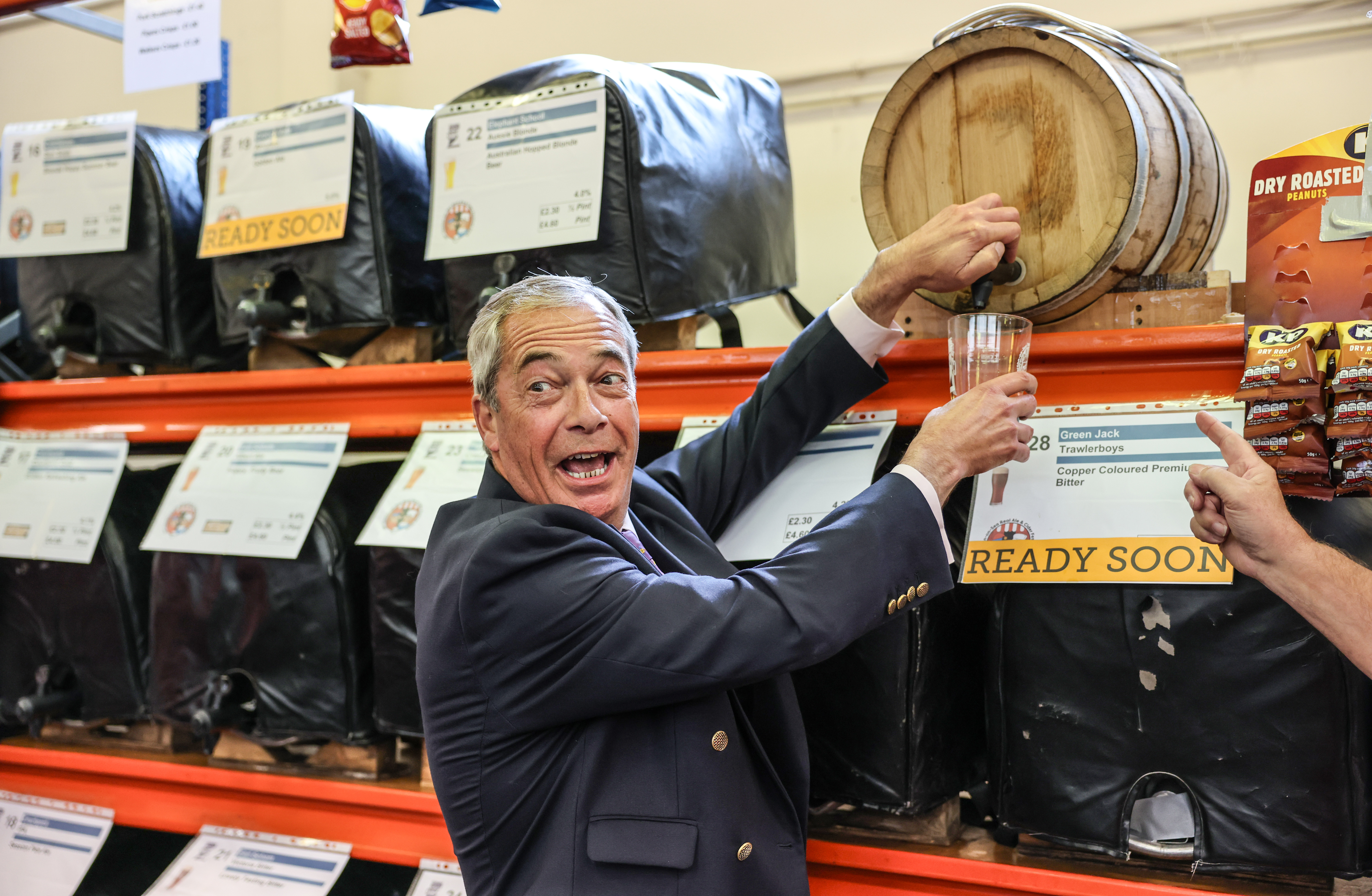 Nigel Farage pouring ale at a real ale and cider festival.