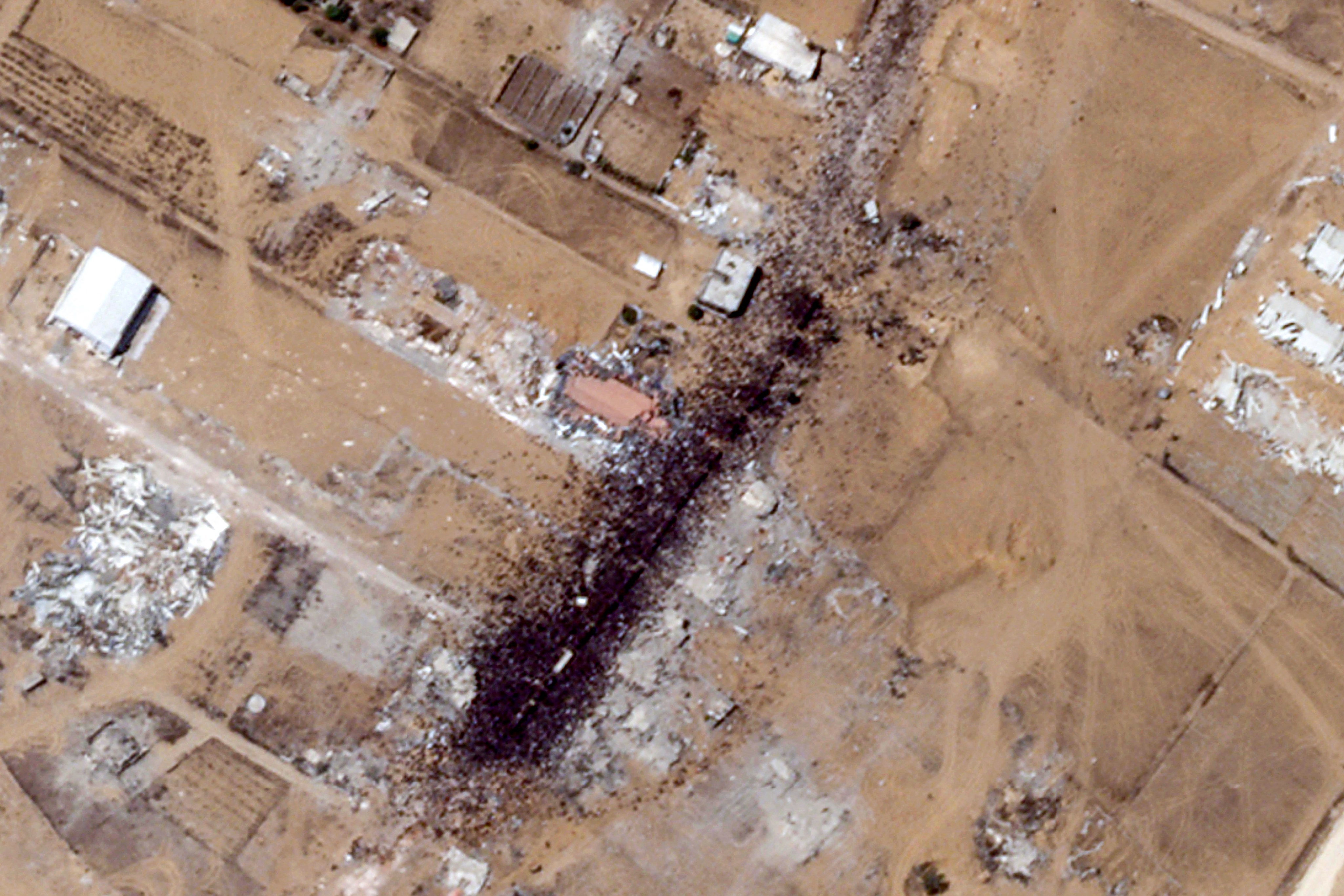 Satellite image of a large crowd of people near a Gaza Humanitarian Foundation distribution site in Khan Yunis.