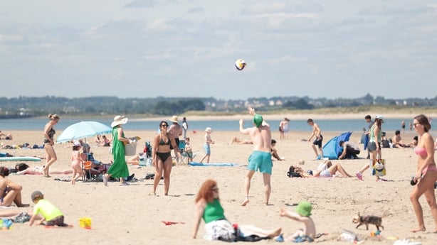 People enjoy themselves during sunny weather on Burrow Beach in north Dublin