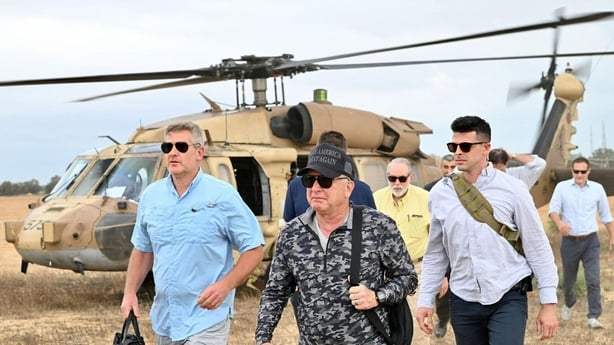 Steve Witkoff and Mike Huckabee leave a helicopter in Gaza en route to an aid site
