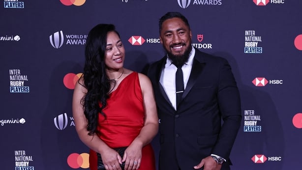 Ireland's inside centre Bundee Aki (R) arrives with his wife Kayla to attend the 23rd edition of the annual World Rugby Awards ceremony at the Opera Garnier in Paris on October 29, 2023. (Photo by Anne-Christine POUJOULAT / AFP)
