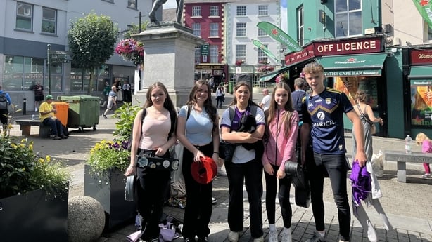 Muireann Ní Chuillin, Cliodhna Ní Chuillin, Sophie Wickham, Meadhbh Ní Chuillin and Liam Stafford standing in Wexford town