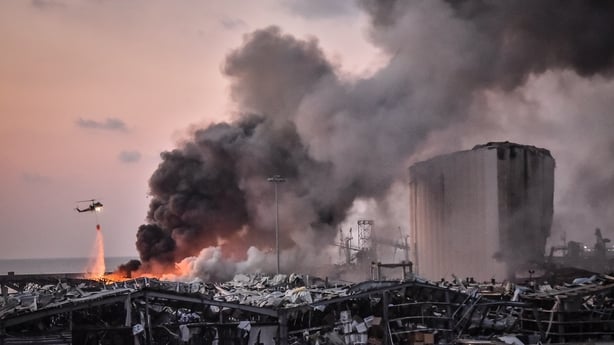 A military helicopter tries to put out a fire at the port after the explosion on 4 August 2020
