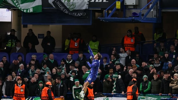 Marc Guiu of Chelsea celebrates after scoring his side's second goal, front of the Shamrock Rovers supporters, during the UEFA Conference League 2024/25 league phase match between Chelsea and Shamrock Rovers at Stamford Bridge 