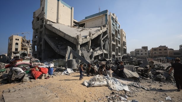 A partially collapsed building is seen amid damage to other buildings during the afternoon in Gaza