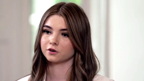 A young girl being interviewed