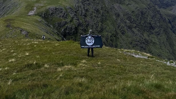 Mountaineer, Dann Cooney on top of a mountain