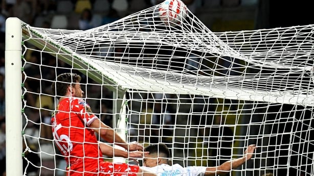 6 August 2025; Sam Bone of Shelbourne scores his side's first goal, despite the attention of Niko Janković of Rijeka, during the UEFA Europa League third qualifying round first leg match between Rijeka and Shelbourne at HNK Rijeka Stadium Rujevica in Rijeka, Croatia. Photo by Igor Kupjlenik/Sportsfi