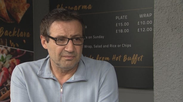 Café owner Rhami Akyol speaks to camera