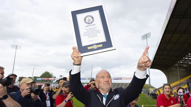 Glen Pollard holds up the confirmation that the group at Wexford Park had broken the world record