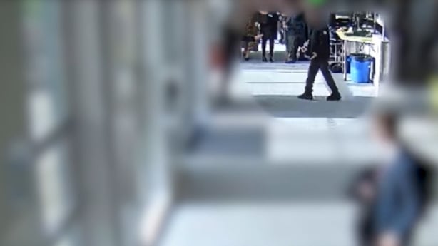 Image shows defendant in the murder of Harvey Willgoose holding a knife in the school canteen