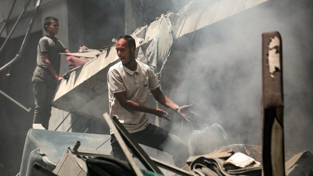 A Palestinian man reacts as he searches through the rubble following an Israeli strike that hit Gaza City's southern al-Zeitoun neighbourhood on August 8, 2025. Israel's military will "take control" of Gaza City under a new plan approved by Prime Minister Benjamin Netanyahu's security cabinet, touch