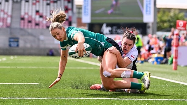 9 August 2025; Anna McGann of Ireland scores her side's second try despite the tackle of Alysha Corrigan of Canada during the Women's Rugby World Cup warm-up match between Ireland and Canada at Affidea Stadium in Belfast. Photo by Ramsey Cardy/Sportsfile