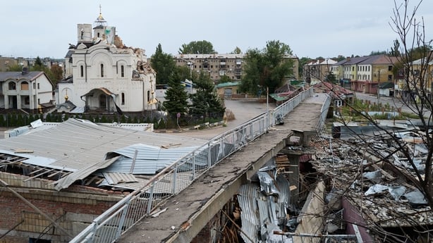 damaged buildings with rubble lying on the ground in Ukraine