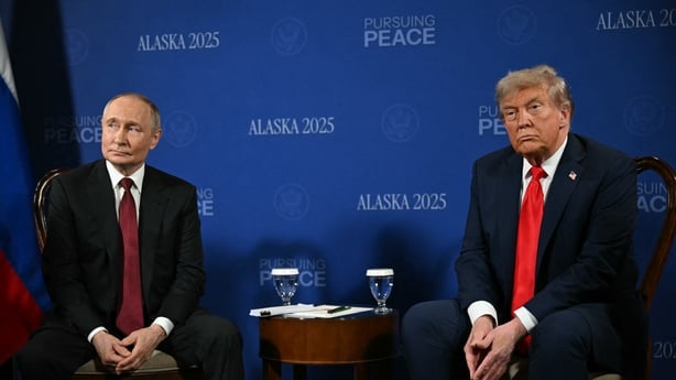 President Donald Trump and President Vladimir Putin sit side by side