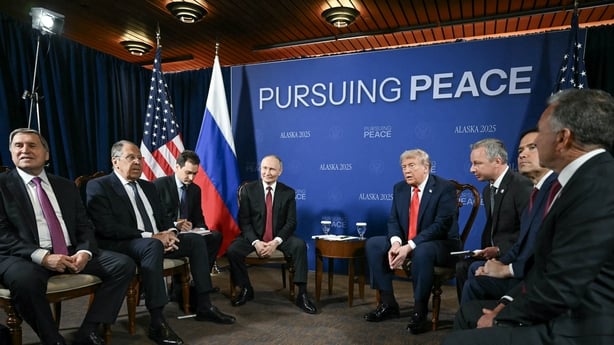 A group of officials sit together