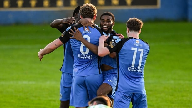 15 August 2025; Max Hutchinson of Finn Harps celebrates with teammates after scoring their side's second goal during the Sports Direct Men's FAI Cup third round match between Finn Harps and Bray Wanderers at Finn Park in Ballybofey, Donegal. Photo by Ramsey Cardy/Sportsfile