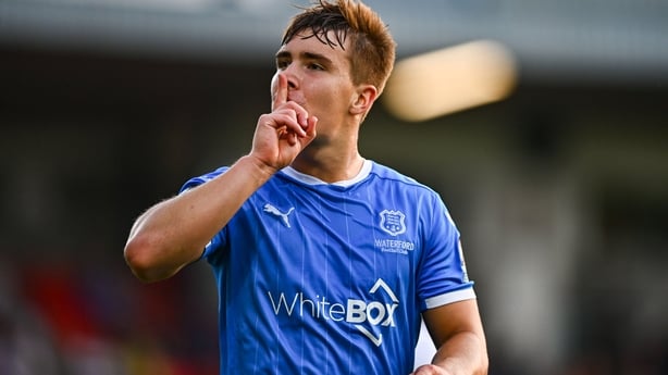 15 August 2025; Tommy Lonergan of Waterford celebrates towards Cork City supporters after scoring his side's first goal during the Sports Direct Men's FAI Cup third round match between Cork City and Waterford at Turner's Cross in Cork. Photo by Tyler Miller/Sportsfile