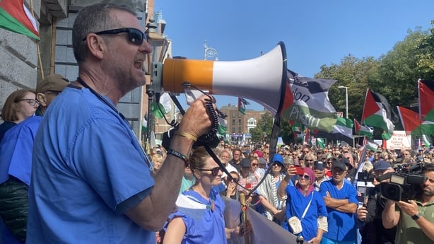 A healthcare worker makes a speech during a protest in solidarity with colleagues in Gaza at Stephen's Green