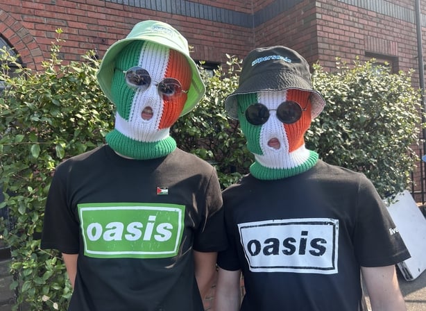Oasis fans in Kneepcap masks.