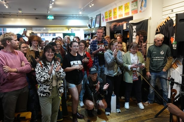 People attend a music session staged in Connolly Books in Dublin's Temple Bar area to show solidarity for Kneecap's Liam Og O hAnnaidh after he appeared at Westminster Magistrates' Court, in London, charged with a terrorism offence. The 27-year-old, of Belfast, who performs under the stage name Mo C