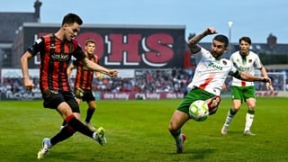 22 August 2025; Liam Smith of Bohemians in action against Sean Maguire of Cork City during the SSE Airtricity Men's Premier Division match between Bohemians and Cork City at Dalymount Park in Dublin. Photo by Tyler Miller/Sportsfile