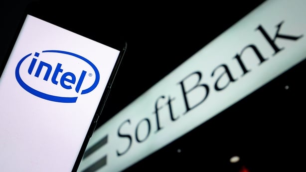 A logo on a phone in front of a sign 