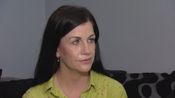Daniel Colgan's mother, Germaine, sits on a couch.
