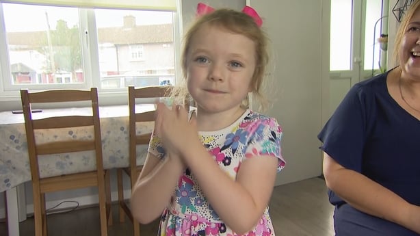 Lucy Lowry claps her hands together.