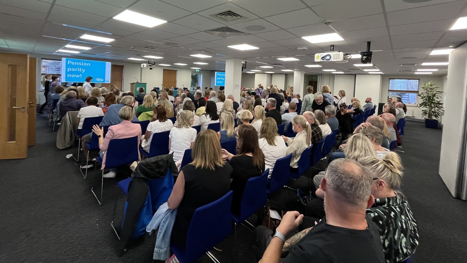 School secretaries and caretakers gather ahead of strike