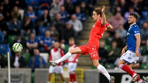 28 August 2025; Harry Wood of Shelbourne scores his side's first goal during the UEFA Conference League Play-off Round second leg match between Linfield and Shelbourne at the Clearer Twist National Football Stadium, Windsor Park in Belfast. Photo by Stephen McCarthy/Sportsfile