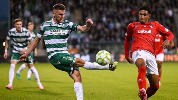 28 August 2025; Dylan Watts of Shamrock Rovers in action against Paulo Victor of CD Santa Clara during the UEFA Conference League Play-off Round second leg match between Shamrock Rovers and CD Santa Clara at Tallaght Stadium in Dublin. Photo by David Fitzgerald/Sportsfile