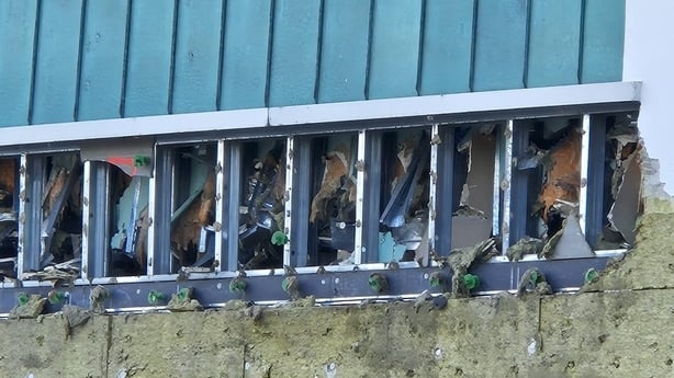 damage in seen to the exterior of a building