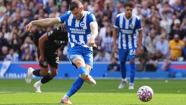 Brighton and Hove Albion's James Milner scores a penalty against Manchester City