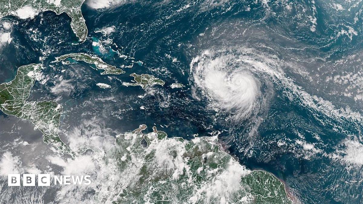 A satellite image shows Hurricane Erin advancing in the Atlantic Ocean