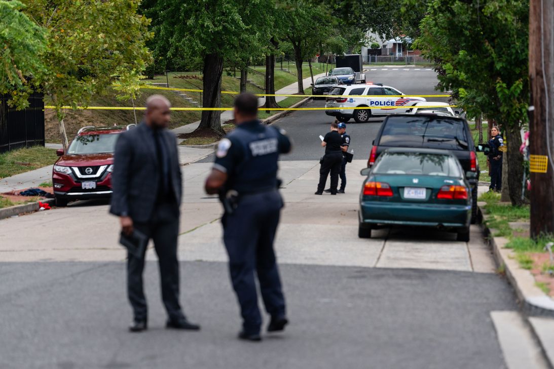 Metropolitan Police Department officers respond to a shooting in the Minnesota Avenue NE and Ames Street NE area of Washington, DC, on Wednesday.