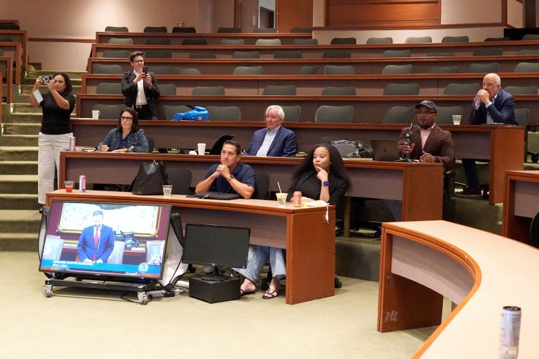 In this picture provided by the Texas Democrats, representatives prepare for a meeting in the hotel auditorium.