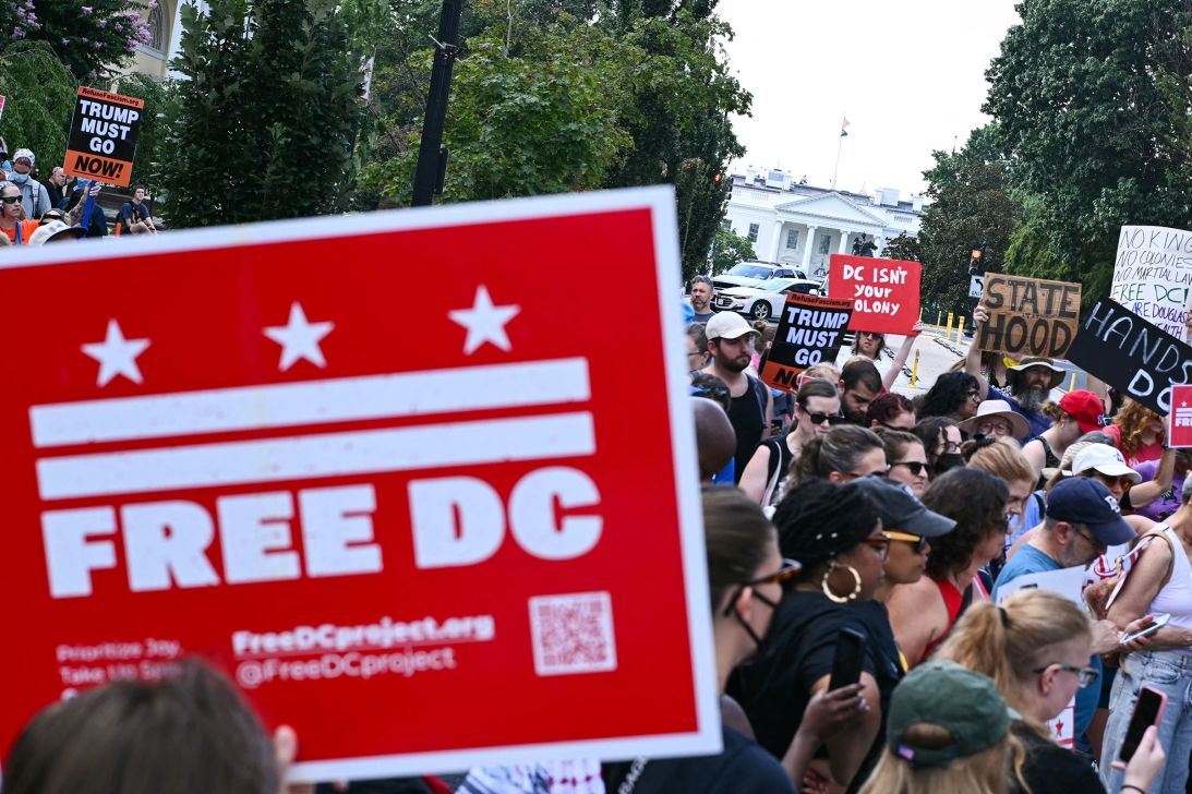 People rally in opposition to President Donald Trump's plans to activate federal law enforcement in Washington, DC, on Monday.