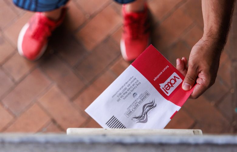 Voters drop off ballots at drop box in Capitol Hill in Seattle Tuesday, Aug. 5 2025.