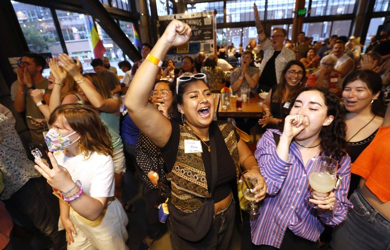The crowd reacts as results come in at for city attorney candidate Erika Evans, incumbent Seattle City Councilmember Alexis Mercedes Rinck, Seattle City Council candidate Dionne Foster at a primary night party at Stoup Brewing in Seattle on Tuesday, August 5, 2025.