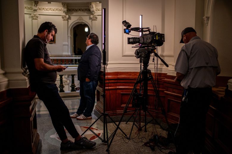 Members of the media wait inside the Texas State Capitol on August 4.