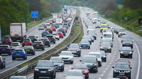 PA Media File photo dated 18/04/25 of motorway traffic on the M5 motorway near Burnham-on-Sea, Somerset.