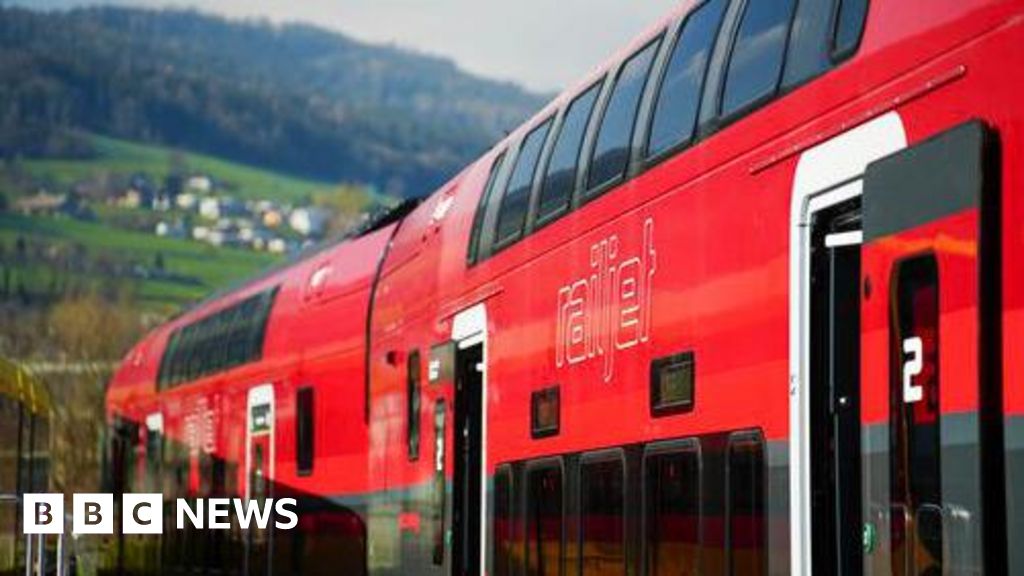 Man jumps on to moving high-speed train