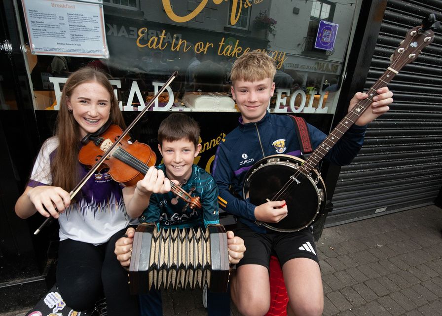 Maria Gilbane, Peter Gilbane and Kyle Cullen pictured on the main street on the opening day of the Fleadh Cheoil na hEireann on Sunday. Pic: Jim Campbell
