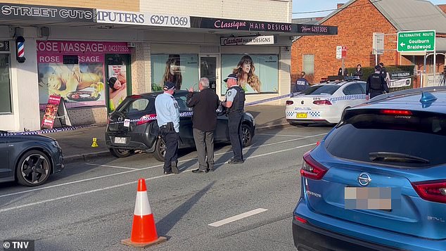 Officers are pictured on Crawford Street, where investigations continue